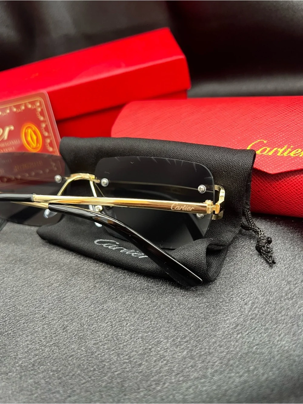 Cartier Men's Black & Gold Rimless Sunglasses with Scalloped Lenses